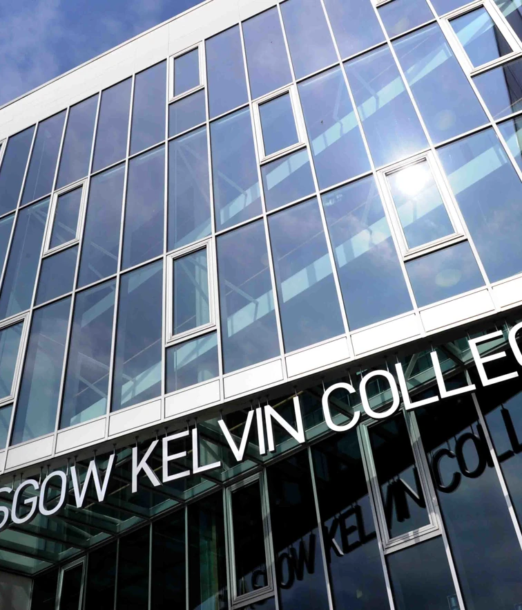 Close-up of Glasgow Kelvin College Springburn Campus entrance, highlighting the building’s modern design and glass-panelled exterior. Close-up of Glasgow Kelvin College Springburn Campus entrance, highlighting the building’s modern design and glass-panelled exterior.